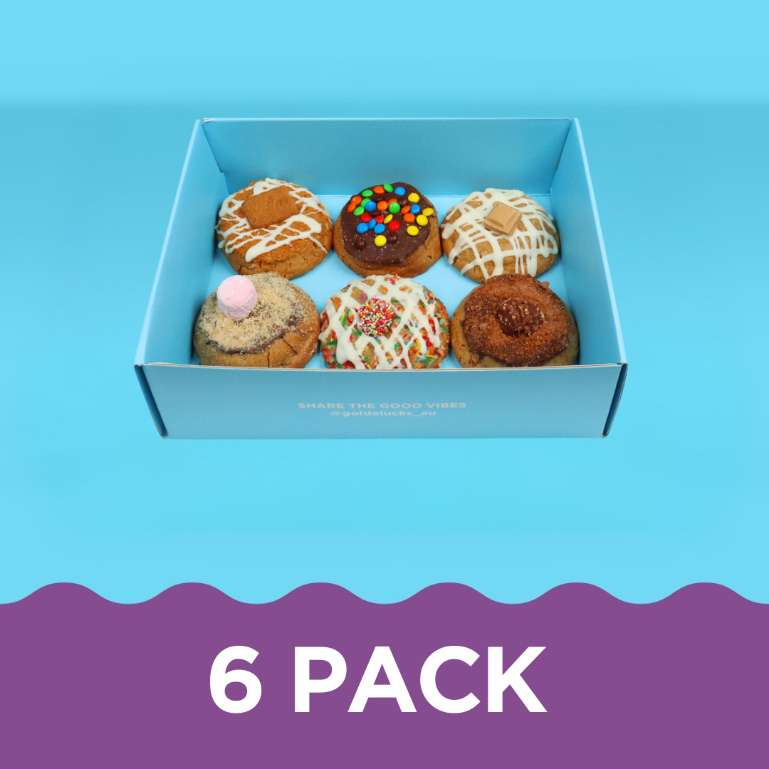 Six premium fully loaded cookies packed with chocolate toppings in gift packaging